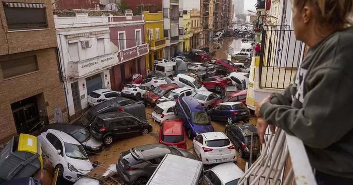 AP PHOTOS: Death by water, burial by mud. Images of Spain's floods of the century