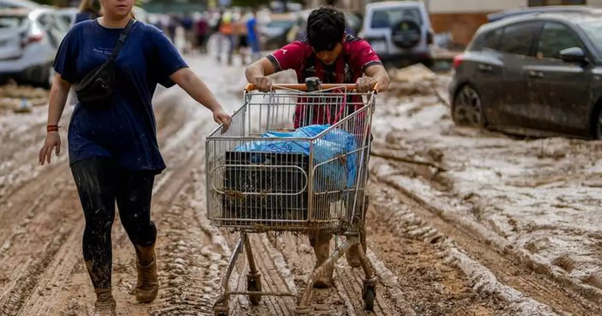 Flood survivors say regional Spanish officials waited too long to warn them of the danger