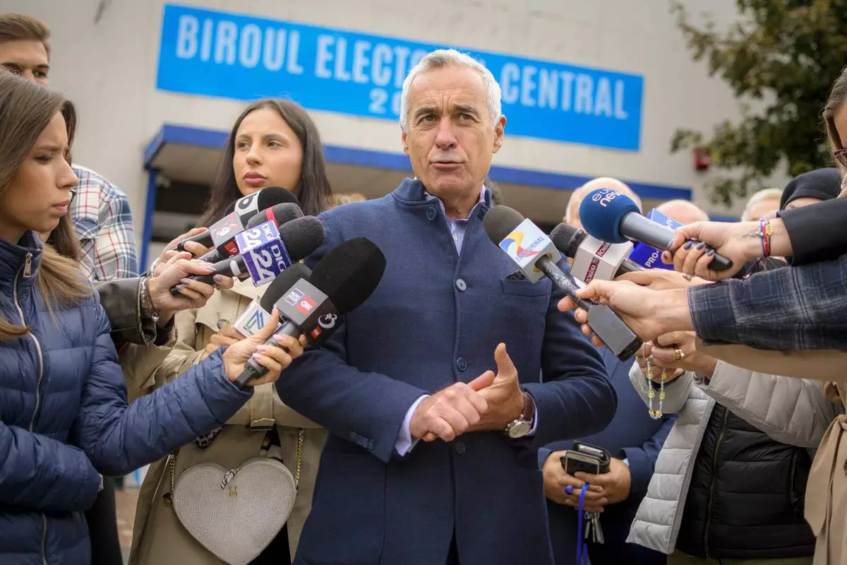 Calin Georgescu, running as an independent candidate for president, speaks to media after registering his bid in the country's presidential elections, in Bucharest, Romania, Tuesday, Oct. 1, 2024. (AP Photo/Alexandru Dobre)