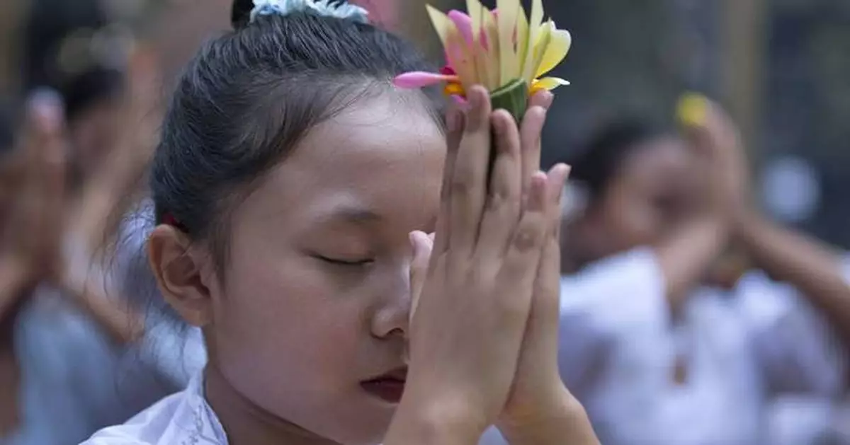 In Bali, young girls dance in a traditional Hindu festival threatened by changing times