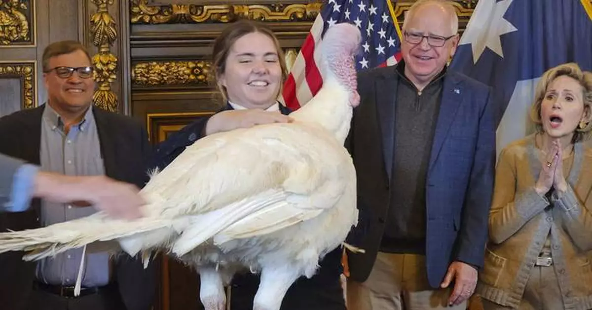 Tim Walz accepts turkey presentation as he eases back into his duties as Minnesota's governor