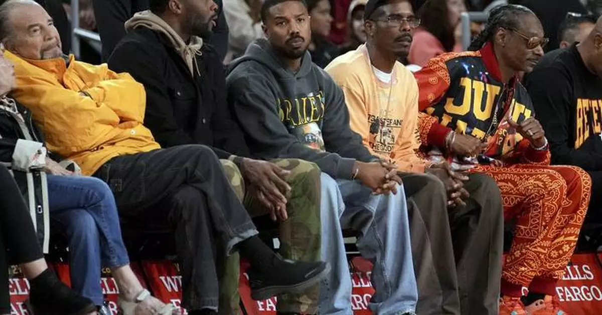 Michael B. Jordan uses timeout at women's college basketball game to sign smoldering photo