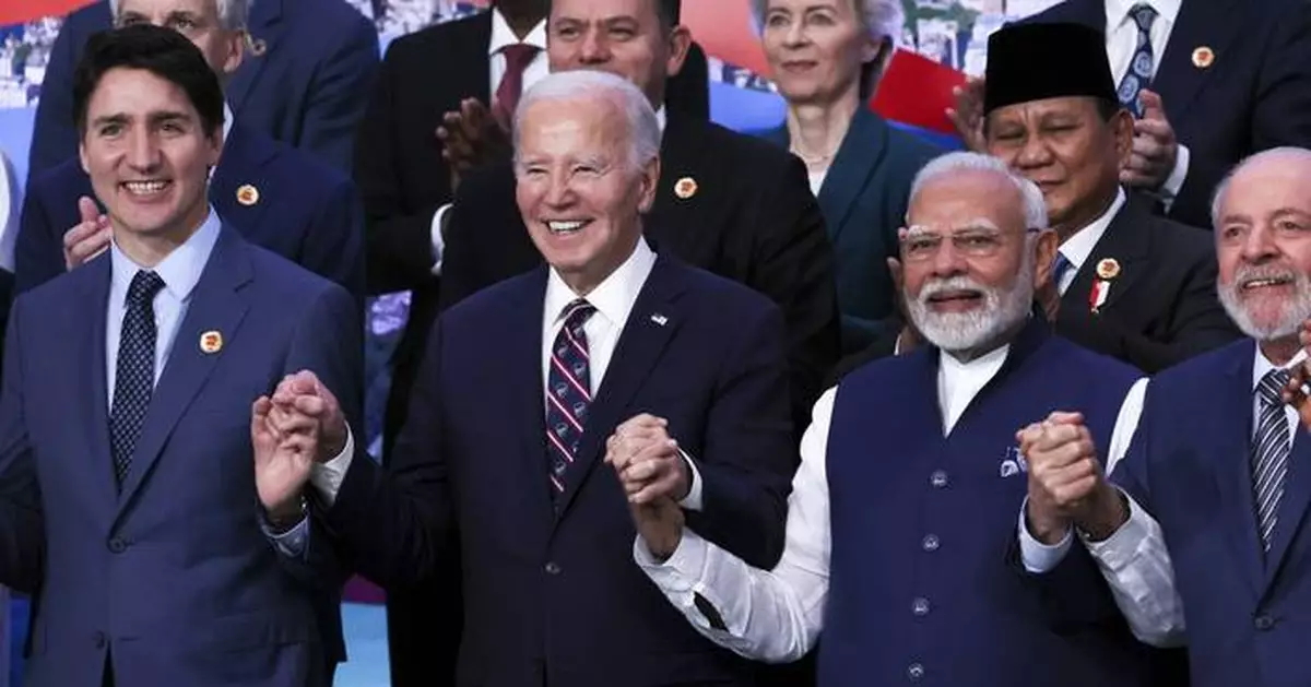 Biden appeals to world leaders to stay in the climate fight as Trump casts shadow