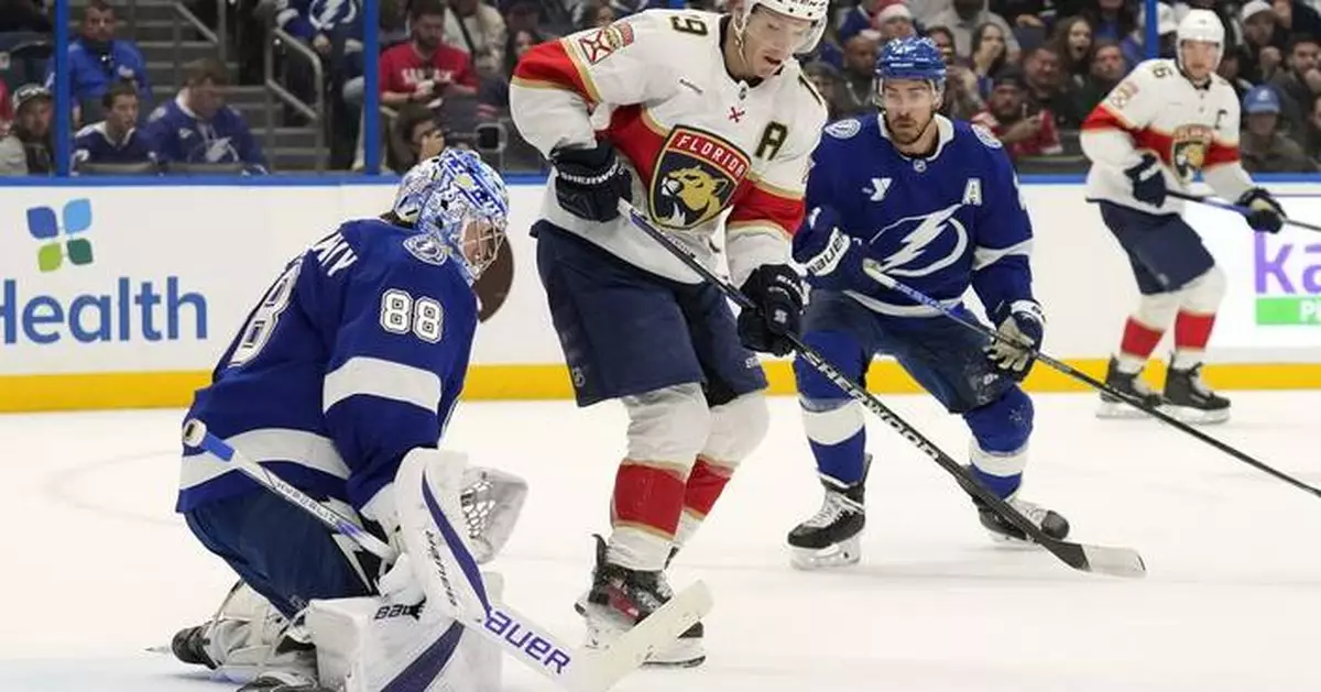 Panthers Tkachuk helped off the ice after collision with Tampa Bay's Kucherov; returns to game