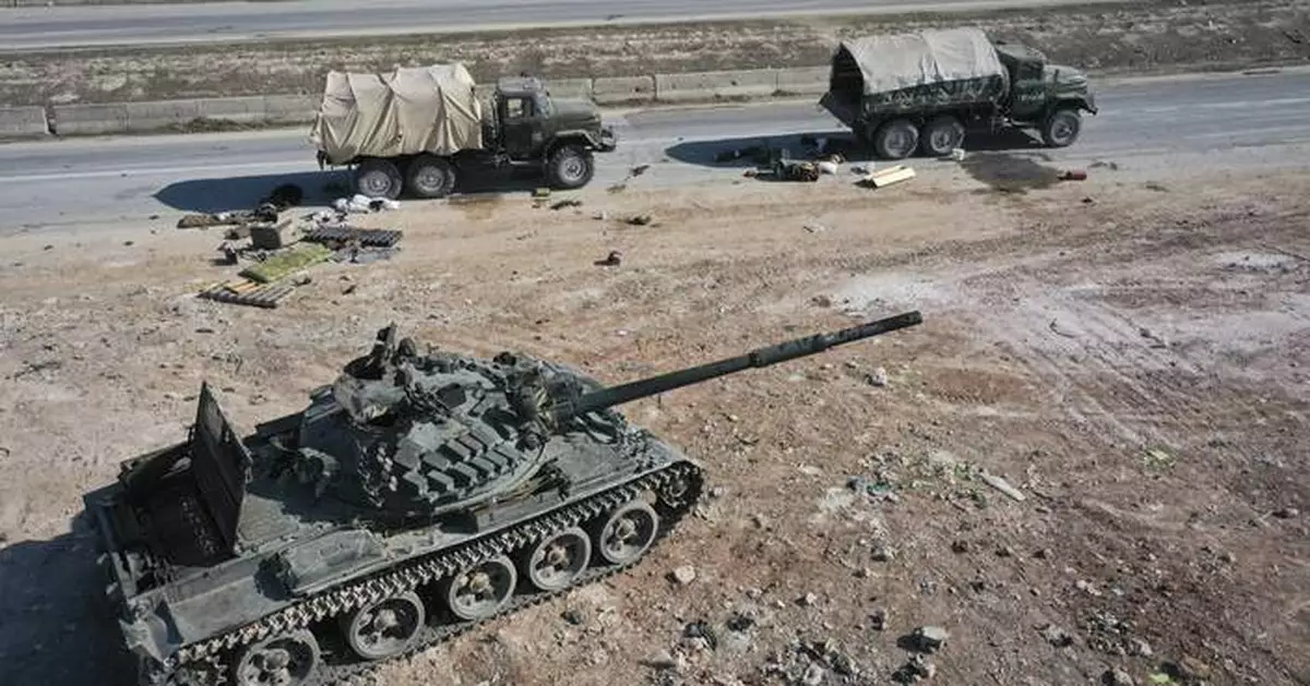 Thousands flee as Syrian insurgents advance to the doorstep of the country's third-largest city