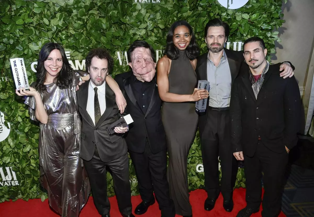 From left, Vanessa McDonnell, Aaron Schimberg, Adam Pearson, Gabriel Mayers, Sebastian Stan and Mike Marino pose with the best feature award for "A Different Man" during The Gothams Film Awards at Cipriani Wall Street on Monday, Dec. 2, 2024, in New York. (Photo by Evan Agostini/Invision/AP)
