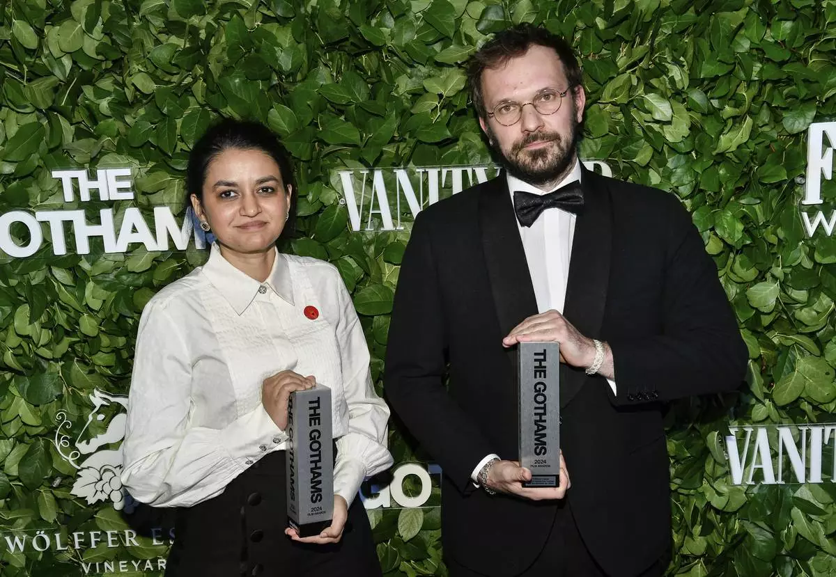 Indian filmmaker Payal Kapadia, left, and producer Thomas Hakim pose with the best international feature award for "All We Imagine as Light" during The Gothams Film Awards at Cipriani Wall Street on Monday, Dec. 2, 2024, in New York. (Photo by Evan Agostini/Invision/AP)