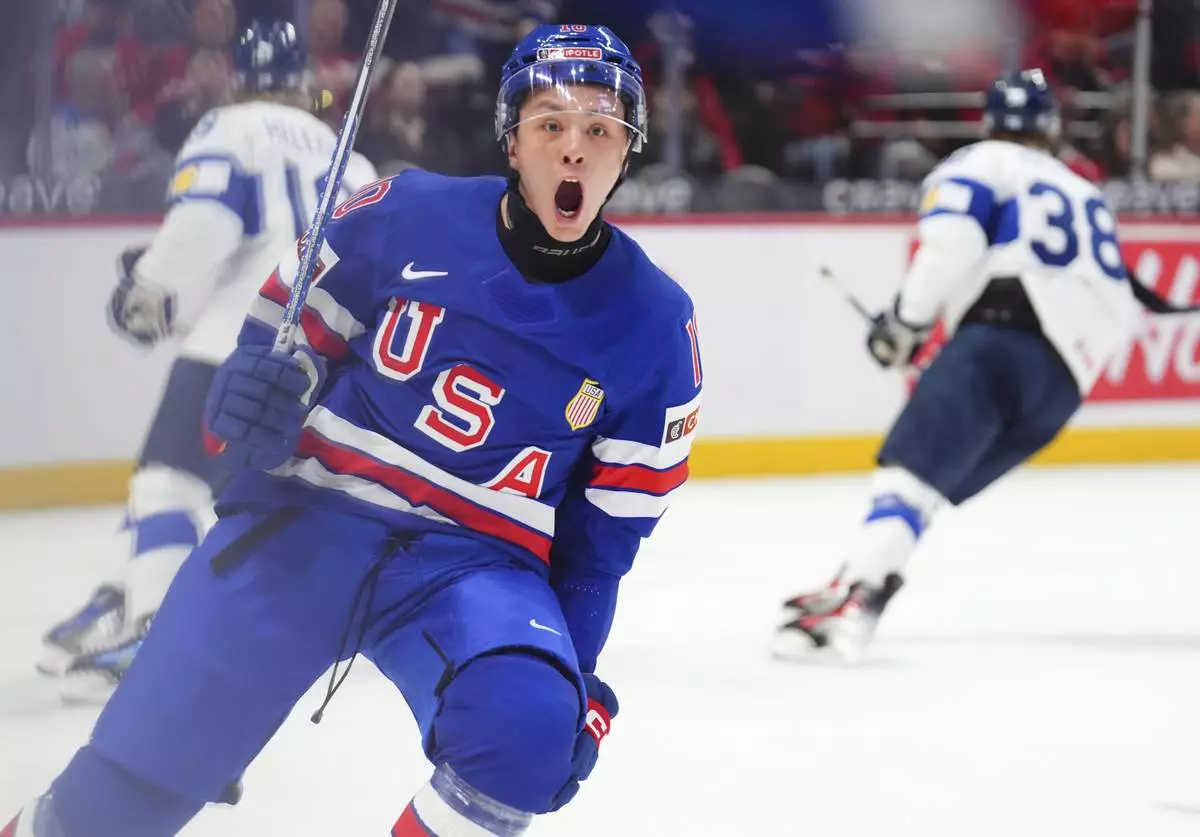 U.S.A. forward Carey Terrance (10) celebrates his goal against Finland during the first period of the IIHF World Junior Hockey Championship tournament in Ottawa on Sunday, Dec. 29, 2024. (Sean Kilpatrick/The Canadian Press via AP)