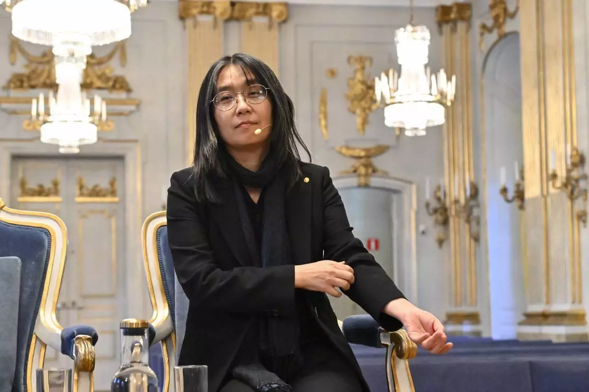 South Korean writer Han Kang, winner of the 2024 Nobel Prize in Literature, arrives for a news conference at the Swedish Academy in Gamla Stan, Stockholm, Sweden, Friday Dec. 6, 2024. (Anders Wiklund/TT News Agency via AP)
