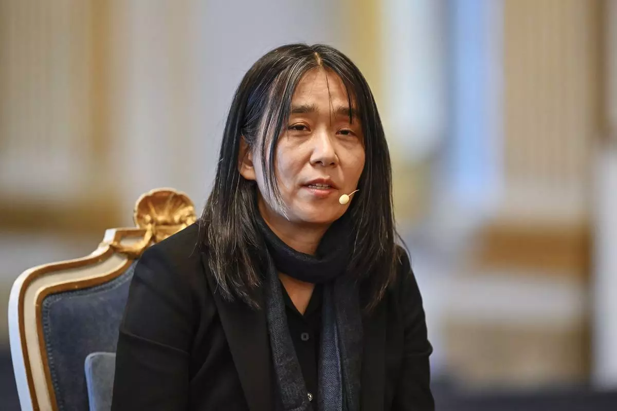 South Korean writer Han Kang, winner of the 2024 Nobel Prize in Literature, speaks during a news conference at the Swedish Academy in Gamla Stan, Stockholm, Sweden, Friday Dec. 6, 2024. (Anders Wiklund/TT News Agency via AP)