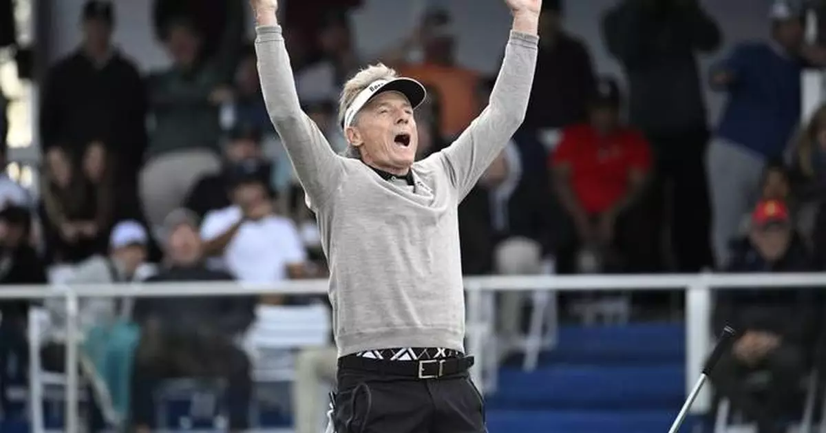 Tiger's son makes the ace. Bernhard Langer makes the winning putt in playoff over Woods at PNC