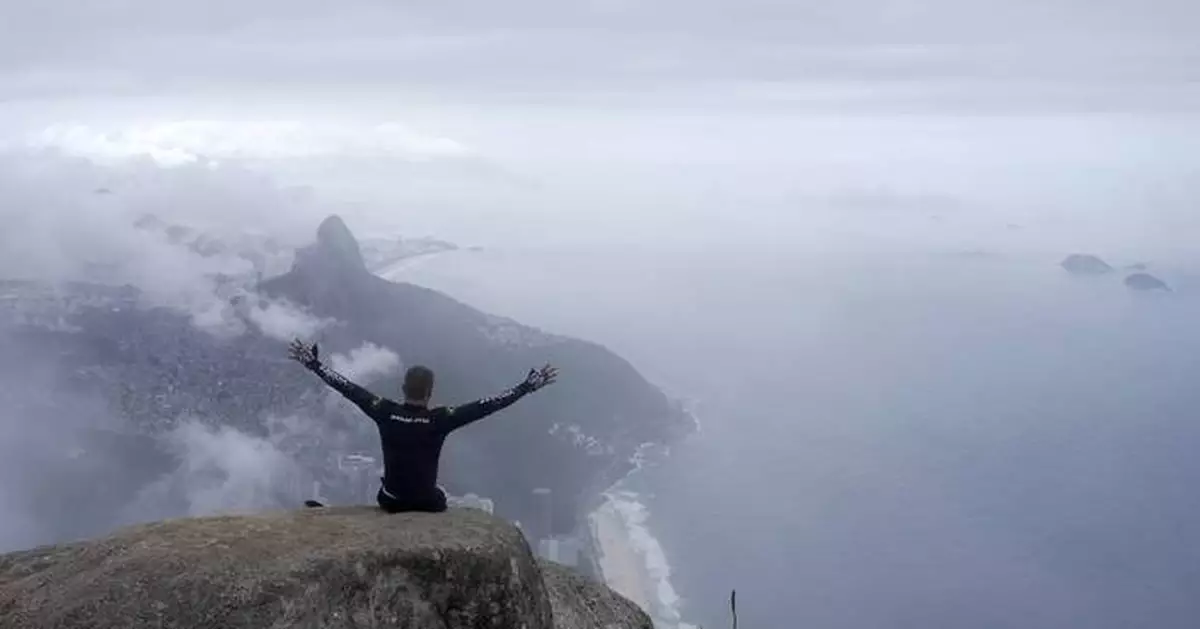 A paraplegic man in Brazil is lifted into the clouds on one of Rio de Janeiro's hardest trails