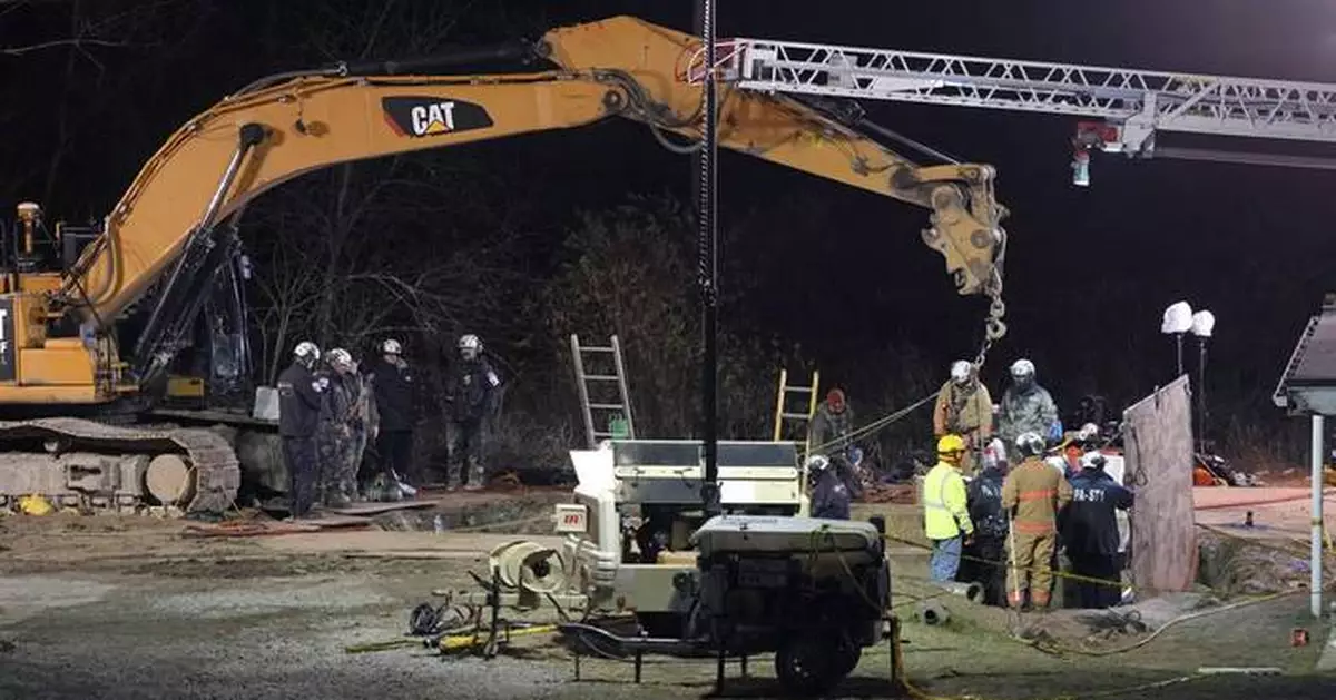 Rescuers reassess safety in search for a woman they believe fell into a Pennsylvania sinkhole