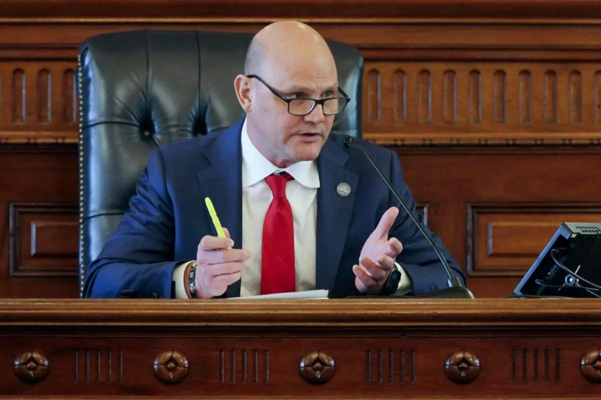 Kansas Secretary of State Scott Schwab makes remarks during a meeting of the state’s presidential electors, Tuesday, Dec. 17, 2024, in the Senate chamber at the Statehouse in Topeka, Kan. Schwab championed a law requiring new voters to show proof of their U.S. citizenship when registering before it was struck down by the federal courts, but now opposes the idea, saying, “It didn’t work out so well.” (AP Photo/John Hanna)