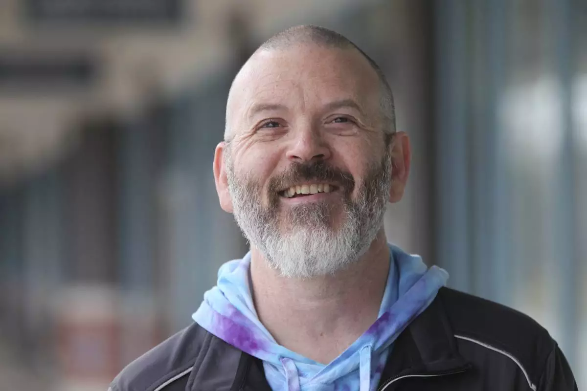 Steven Fish, of Garnett, Kansas, was unable to register to vote in 2014 under a state law requiring people to show proof of their U.S. citizenship, and he returns to the same strip mall where he went to register, Monday, Dec. 9, 2024, in Lawrence, Kan. (AP Photo/John Hanna)