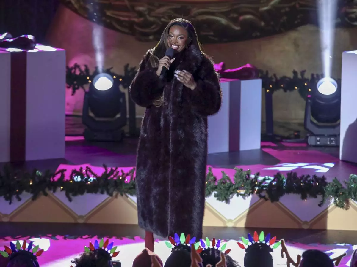 Singer-songwriter Coco Jones participates in the Rockefeller Center Christmas tree lighting ceremony on Wednesday, Dec. 4, 2024, in New York. (Photo by Andy Kropa/Invision/AP)