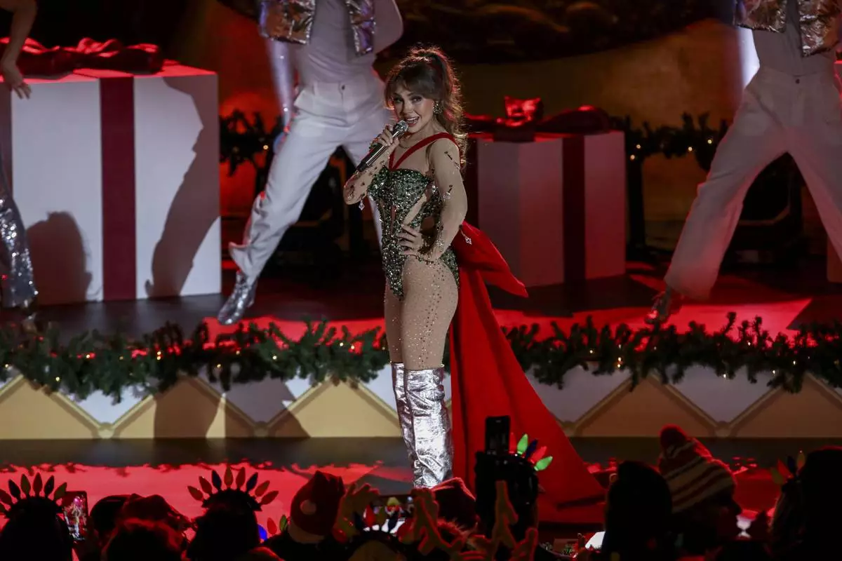 Singer-songwriter Thalia participates in the Rockefeller Center Christmas tree lighting ceremony on Wednesday, Dec. 4, 2024, in New York. (Photo by Andy Kropa/Invision/AP)