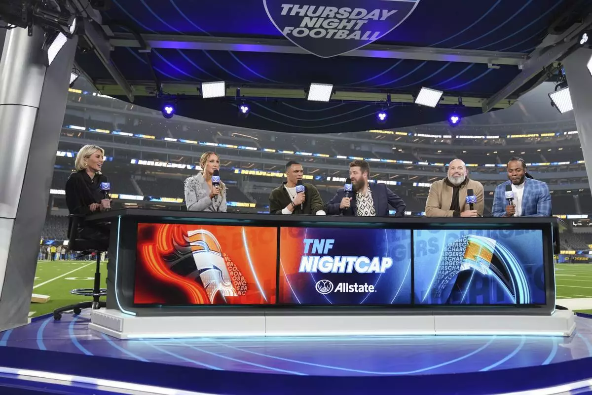 Nikki Glaser, second from left, participates in a segment with the Thursday Night Football crew after an NFL football game between the Los Angeles Chargers and the Denver Broncos, Thursday, Dec. 19, 2024, in Inglewood, Calif. (AP Photo/Eric Thayer)