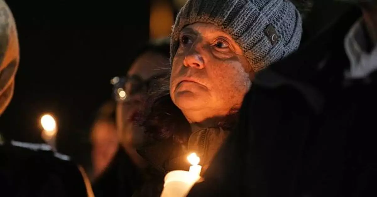 AP PHOTOS: Students reunite with parents after Wisconsin school shooting, community holds vigil