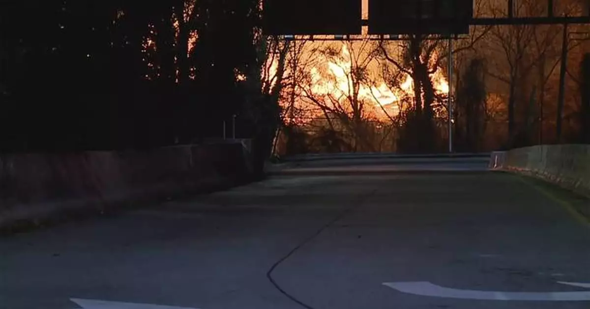 Wind-driven brushfire at Baltimore wood recycling yard closes expressway, light rail, schools