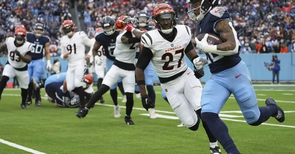 Cincinnati's Jordan Battle and Indy's Jonathan Taylor drop ball before goal line, negating TDs