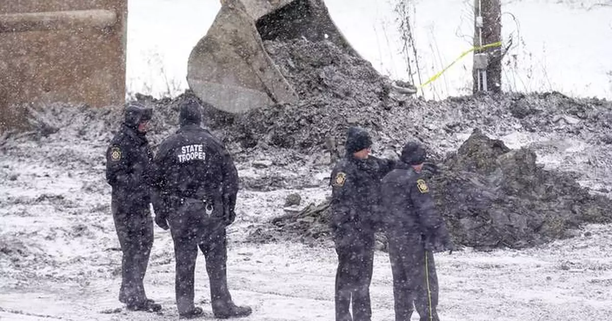 Digging resumes in the search for a woman in a Pennsylvania sinkhole