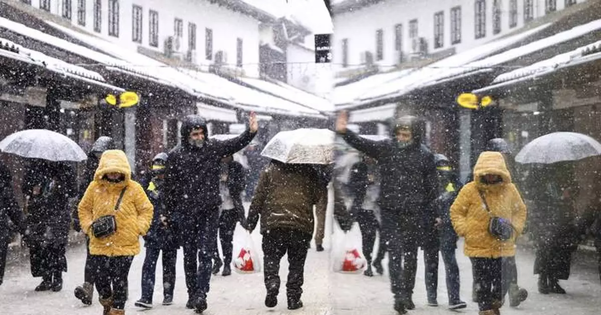 Rescuers reach a stranded hiker in Slovenia but another is missing during a Balkans snowstorm