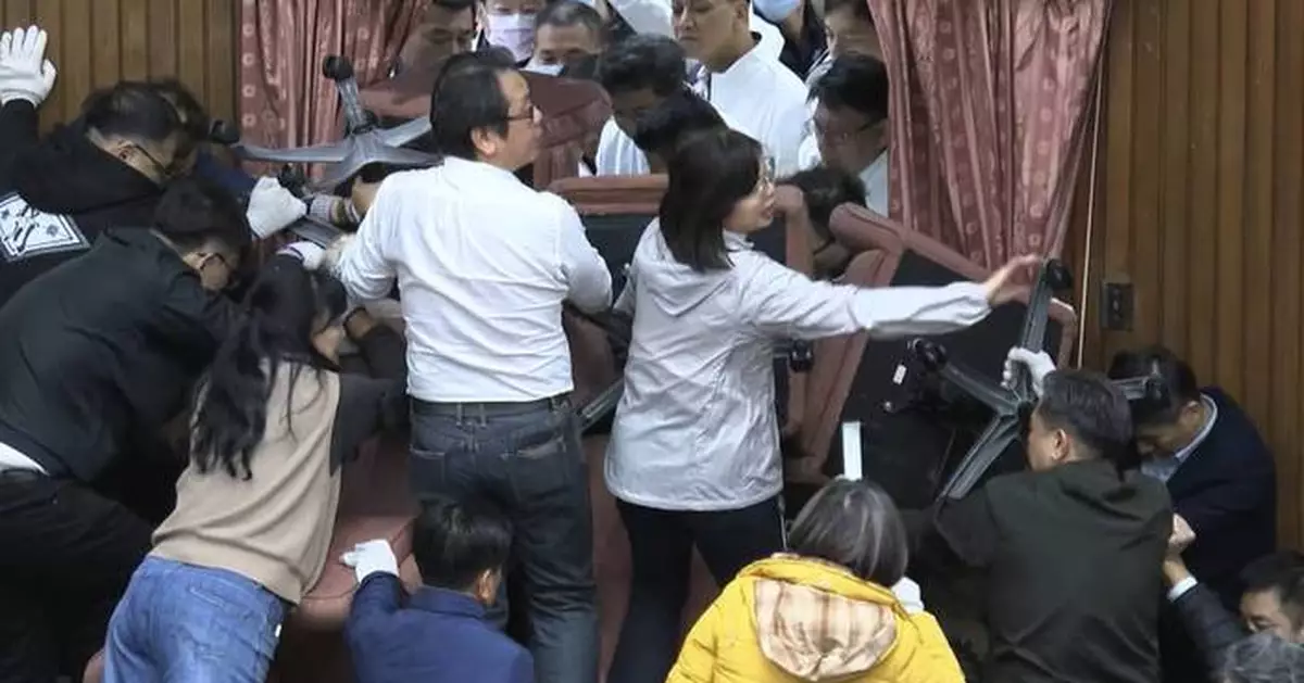 Taiwan lawmakers clash after one party breaks into legislature to occupy speaker's chair