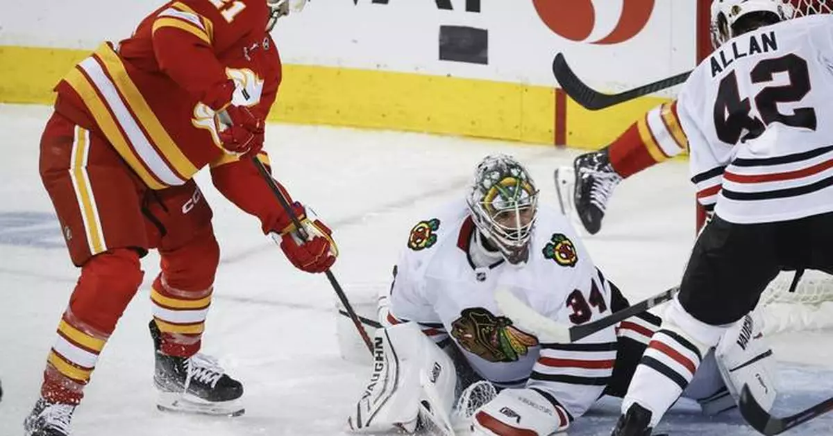 Flames get goals from 6 players in a 6-4 victory over the Blackhawks