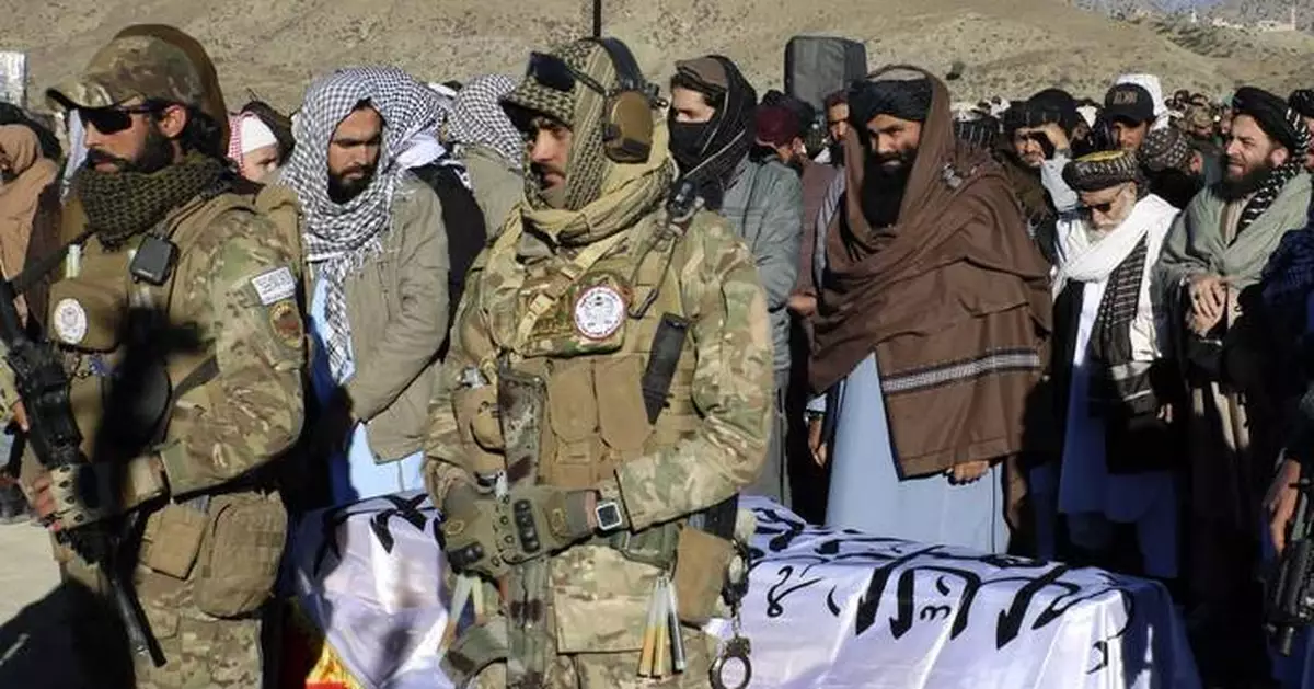 Thousands attend the funeral of a Taliban minister killed by an Islamic State suicide bomber