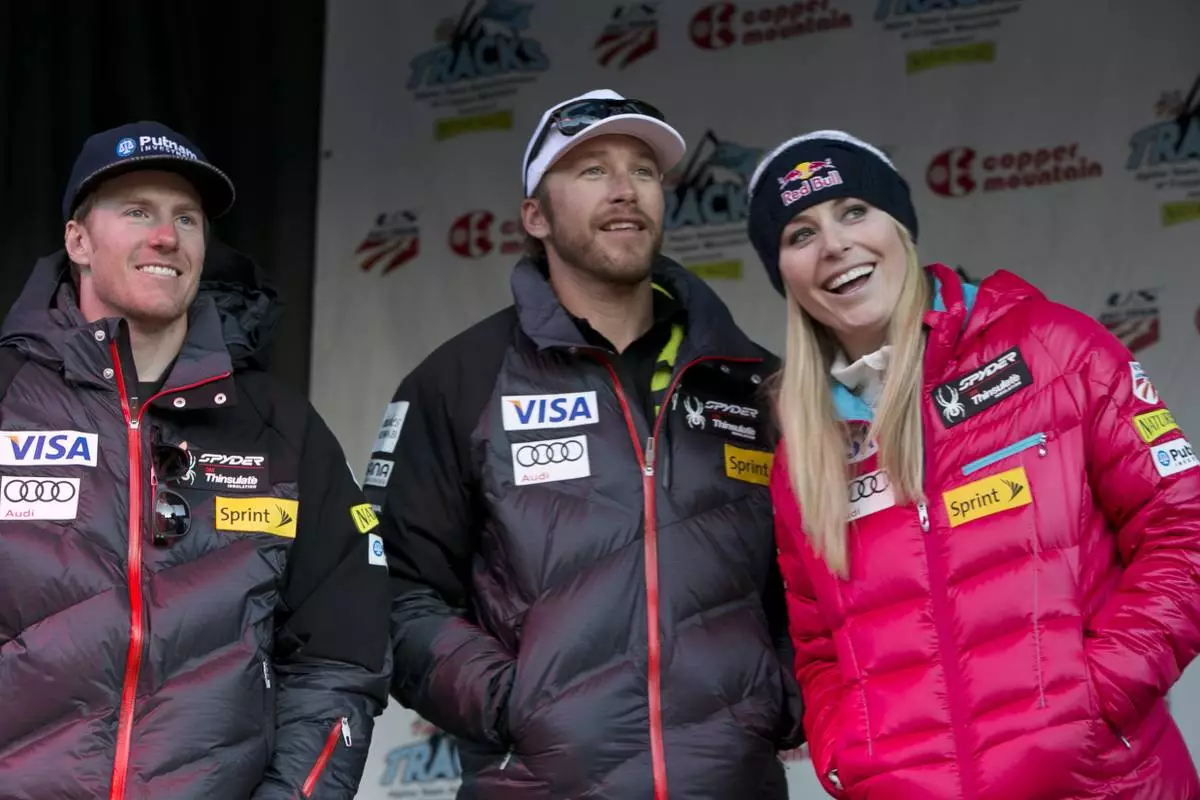FILE - Ted Ligety, left, Bode Miller, Lindsey Vonn stand together at a U.S. Ski Team event at Copper Mountain, Colo., on Friday, Nov. 8, 2013. (AP Photo/Nathan Bilow, File)