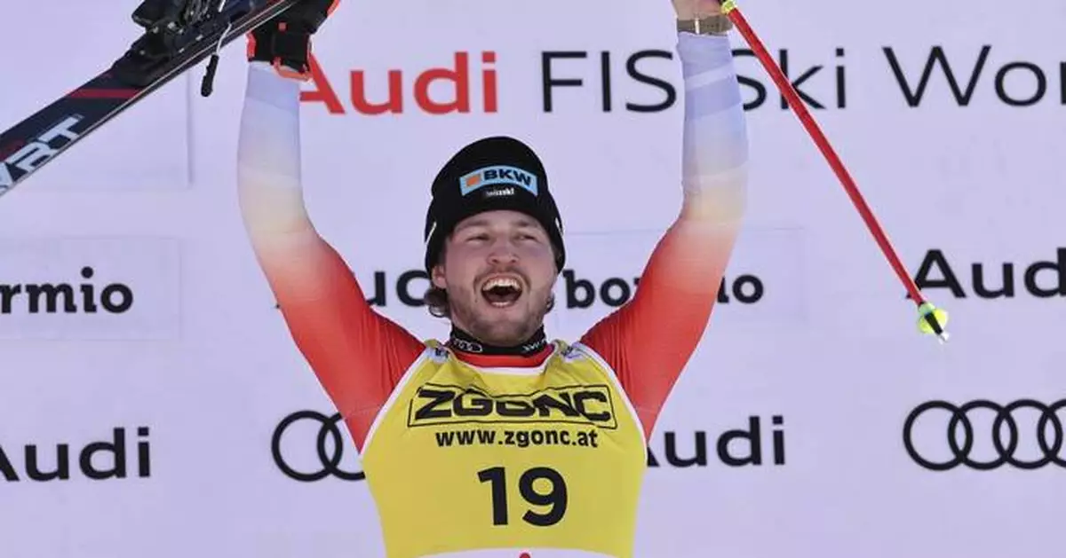 Monney earns first World Cup win after mistake by Swiss teammate Odermatt