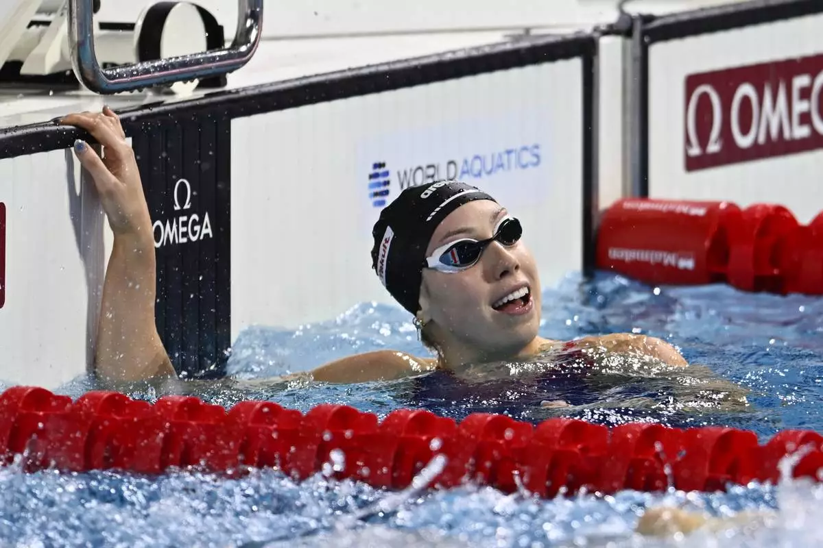 Gretchen Walsh reacts after the team USA won the 4x100 meter final during the World Short Course Swimming Championships in Budapest, Hungary, Tuesday, Dec. 10, 2024. (AP Photo/Denes Erdos)