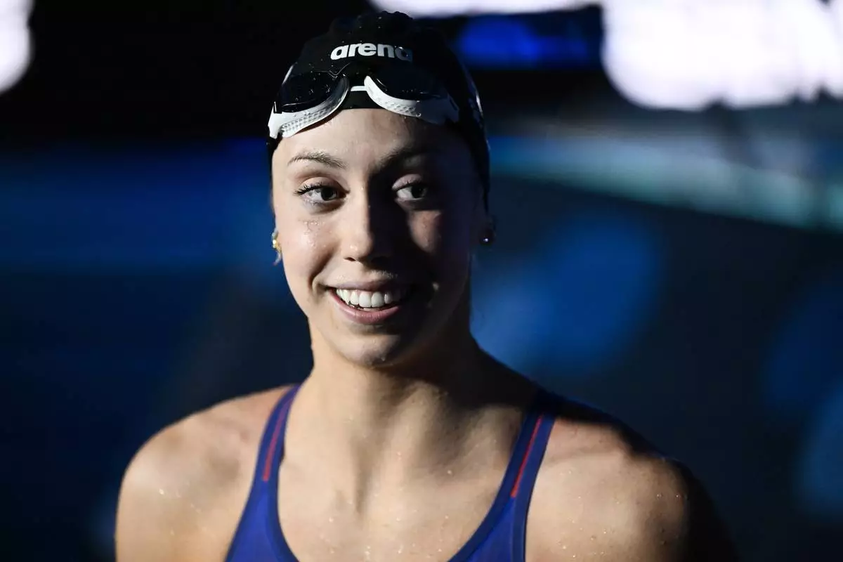 Gretchen Walsh of the USA smiles after setting a world record during a 50-meter butterfly semifinal during the World Short Course Swimming Championships in Budapest, Hungary, Tuesday, Dec. 10, 2024. (AP Photo/Denes Erdos)