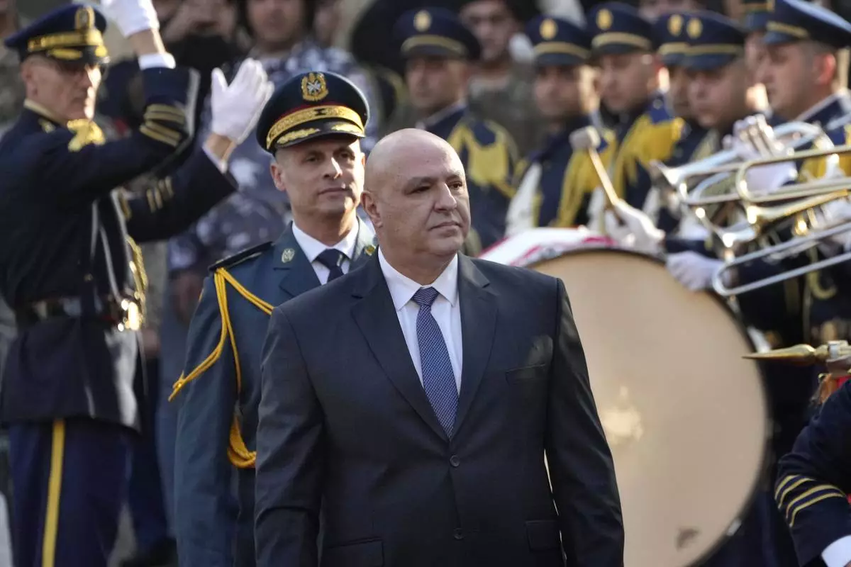 Newly-elected Lebanese President Joseph Aoun reviews the honor guard upon his arrival at the Lebanese Parliament to be sworn in as a new president, in Beirut, Lebanon, Thursday, Jan. 9, 2025. (AP Photo/Hussein Malla)