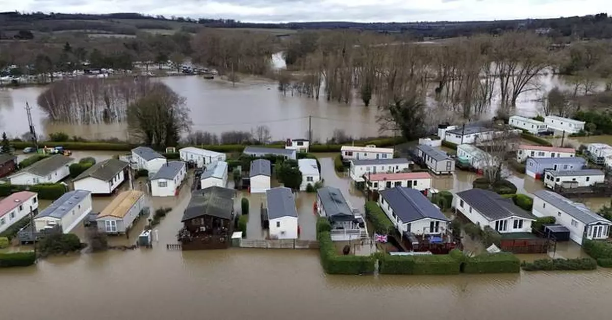 Dozens rescued as rain leads to flooding and travel is disrupted in parts of the UK