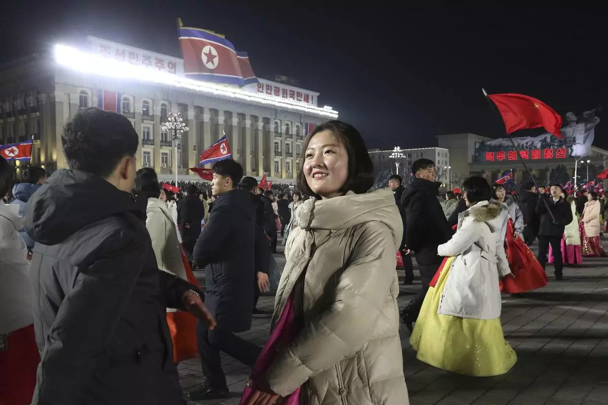 Youth and students gather for a New Year celebration at Kim Il Sung Square on Tuesday, Dec. 31, 2024 in Pyongyang, North Korea. (AP Photo/Cha Song Ho)