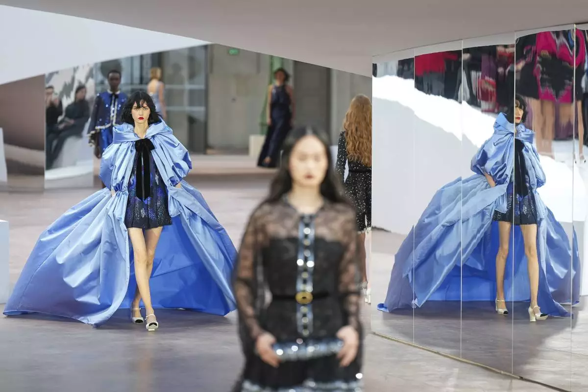A model wears a creation as part of the Chanel Haute Couture Spring Summer 2025 collection, that was presented in Paris, Tuesday, Jan. 28, 2025. (AP Photo/Lewis Joly)
