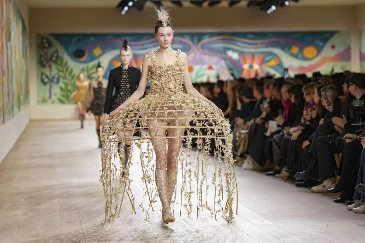 A model wears a creation as part of the Christian Dior Haute Couture Spring Summer 2025 collection, that was presented in Paris, Monday, Jan. 27, 2025. (AP Photo/Lewis Joly).