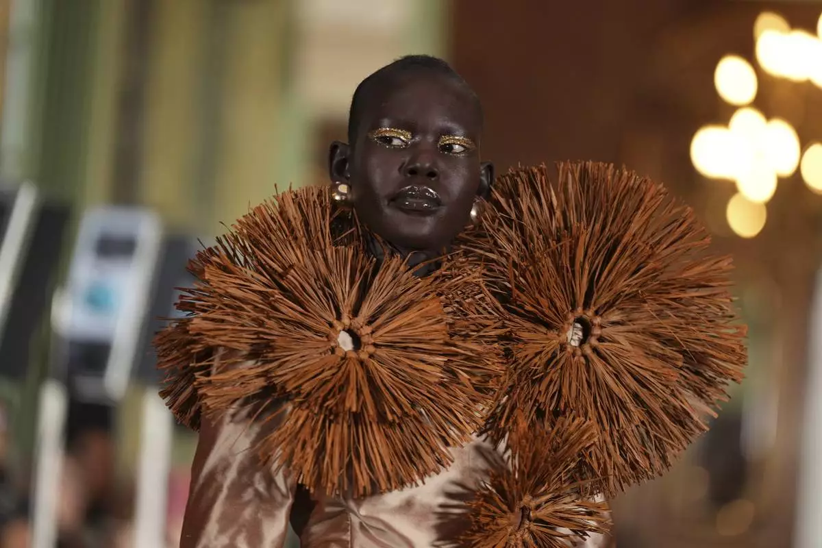 A model wears a creation as part of the Imane Ayissi Haute Couture Spring Summer 2025 collection, that was presented in Paris, Monday, Jan. 27, 2025. (AP Photo/Lewis Joly)