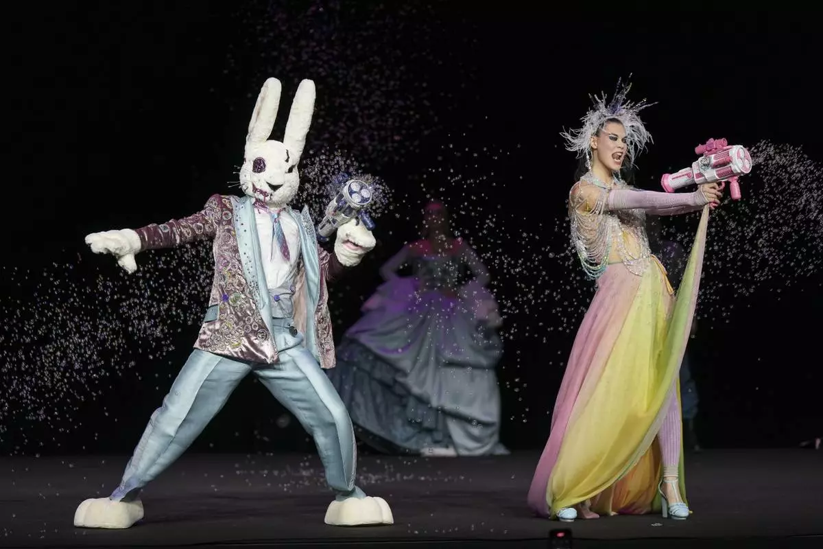 Models wear creations as part of the Julien Fournie Haute Couture Spring Summer 2025 collection, that was presented in Paris, Tuesday, Jan. 28, 2025. (AP Photo/Lewis Joly).