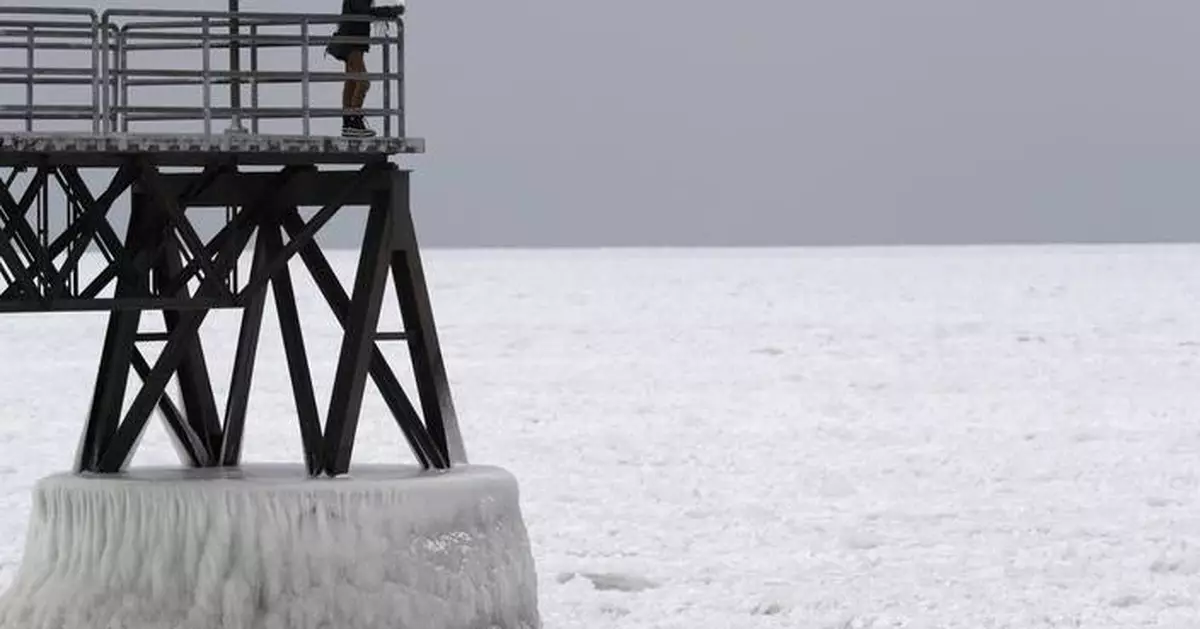 Freighter remains stuck in the ice on a frozen Lake Erie
