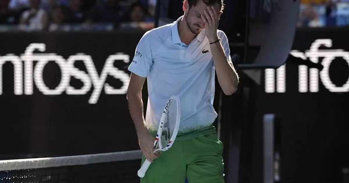 Daniil Medvedev destroys a TV camera attached to the net during his 5-set Australian Open win