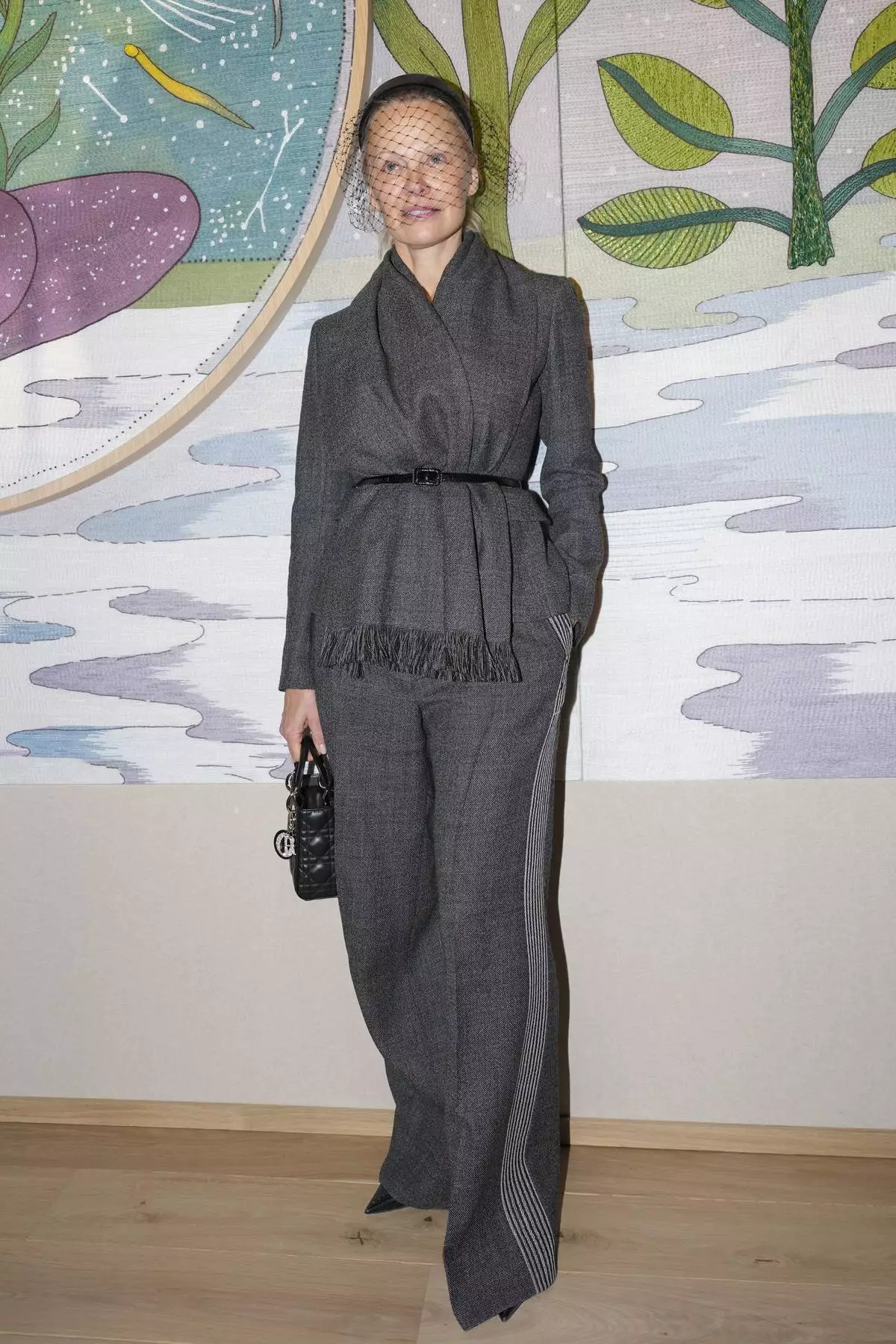 Pamela Anderson arrives for the Christian Dior Haute Couture Spring Summer 2025 collection, that was presented in Paris, Monday, Jan. 27, 2025. (AP Photo/Lewis Joly).