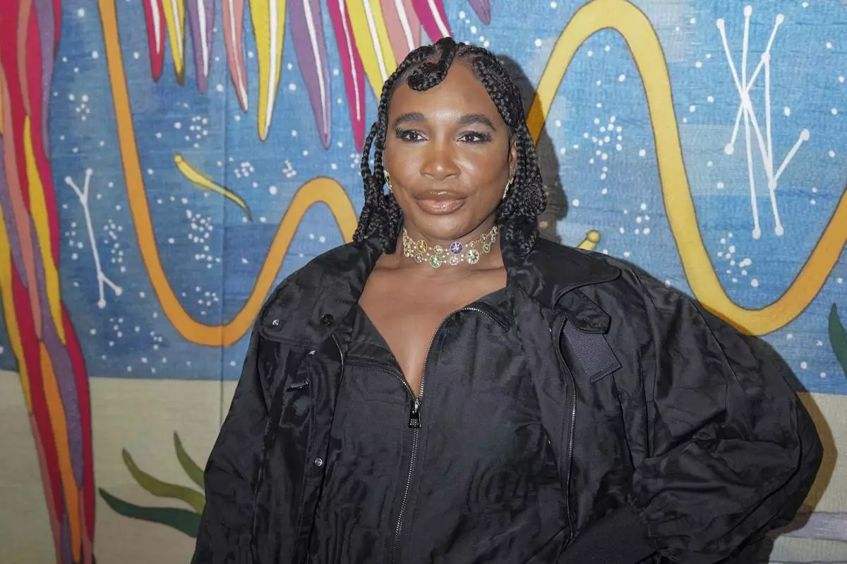 Venus Williams arrives for the Christian Dior Haute Couture Spring Summer 2025 collection, that was presented in Paris, Monday, Jan. 27, 2025. (AP Photo/Lewis Joly).