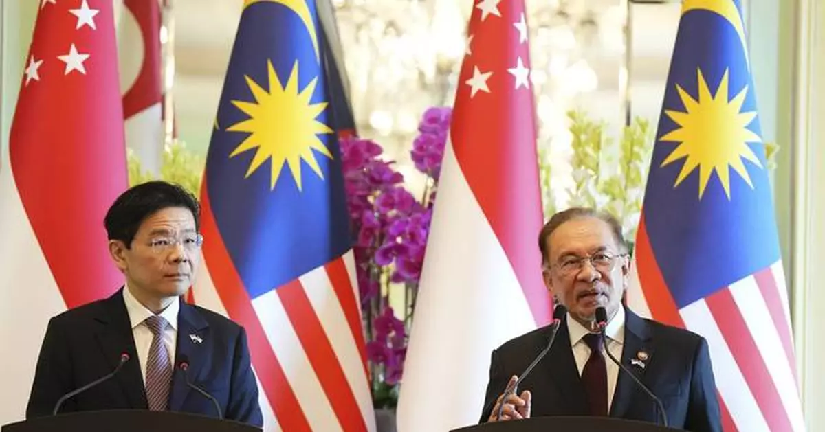 Malaysia and Singapore agree to launch a special economic zone in a rare move to attract investors