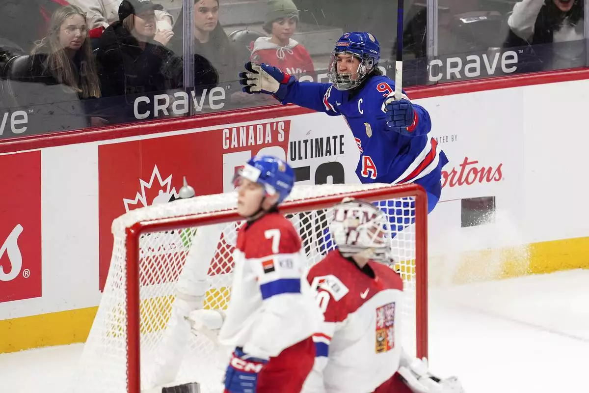United States forward Ryan Leonard (9) celebrates after his goal against Czechia during third-period World Junior hockey championship semifinal game action in Ottawa, Ontario, Saturday, Jan. 4, 2025. (Sean Kilpatrick/The Canadian Press via AP)