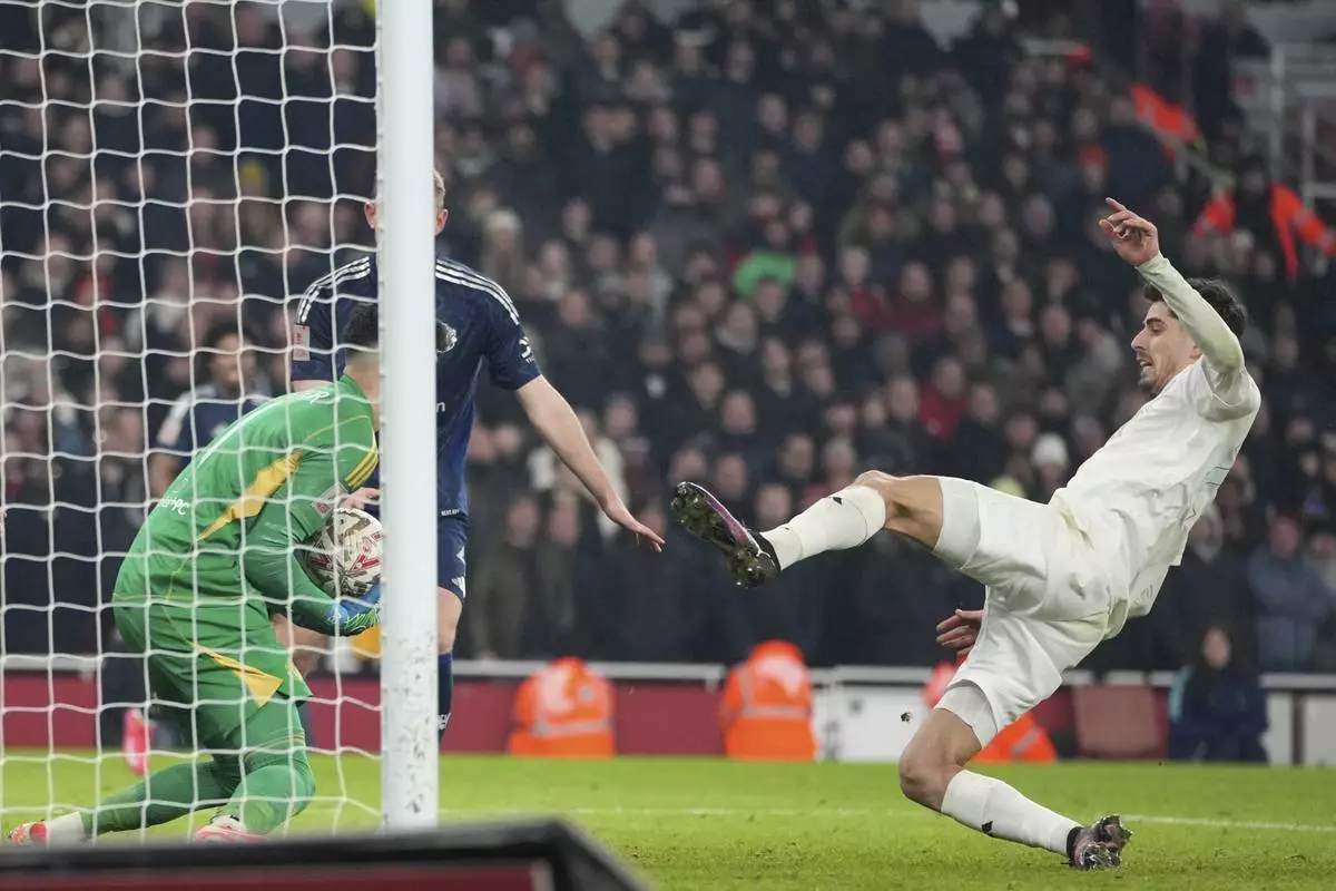 FILE - Arsenal's Kai Havertz, right, attempts a goal as Manchester United's goalkeeper Altay Bayindir saves its during the English FA Cup soccer match between Arsenal and Manchester United at the Emirates stadium in London, Sunday, Jan. 12, 2025. (AP Photo/Kin Cheung, File)