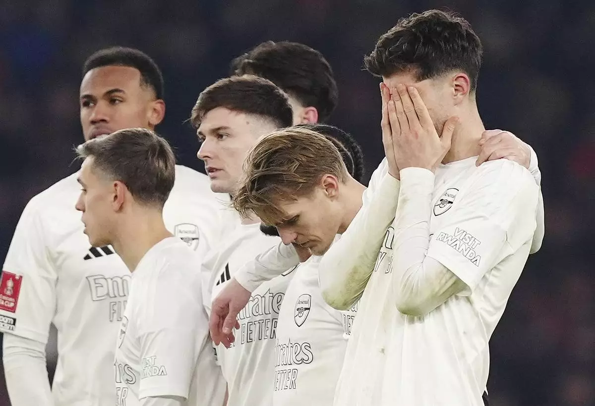 FILE - Arsenal's Kai Havertz, right, reacts after missing a penalty in the shoot-out during the English FA Cup soccer match between Arsenal and Manchester United at the Emirates stadium in London, Sunday, Jan. 12, 2025. (Mike Egerton/PA via AP, File)