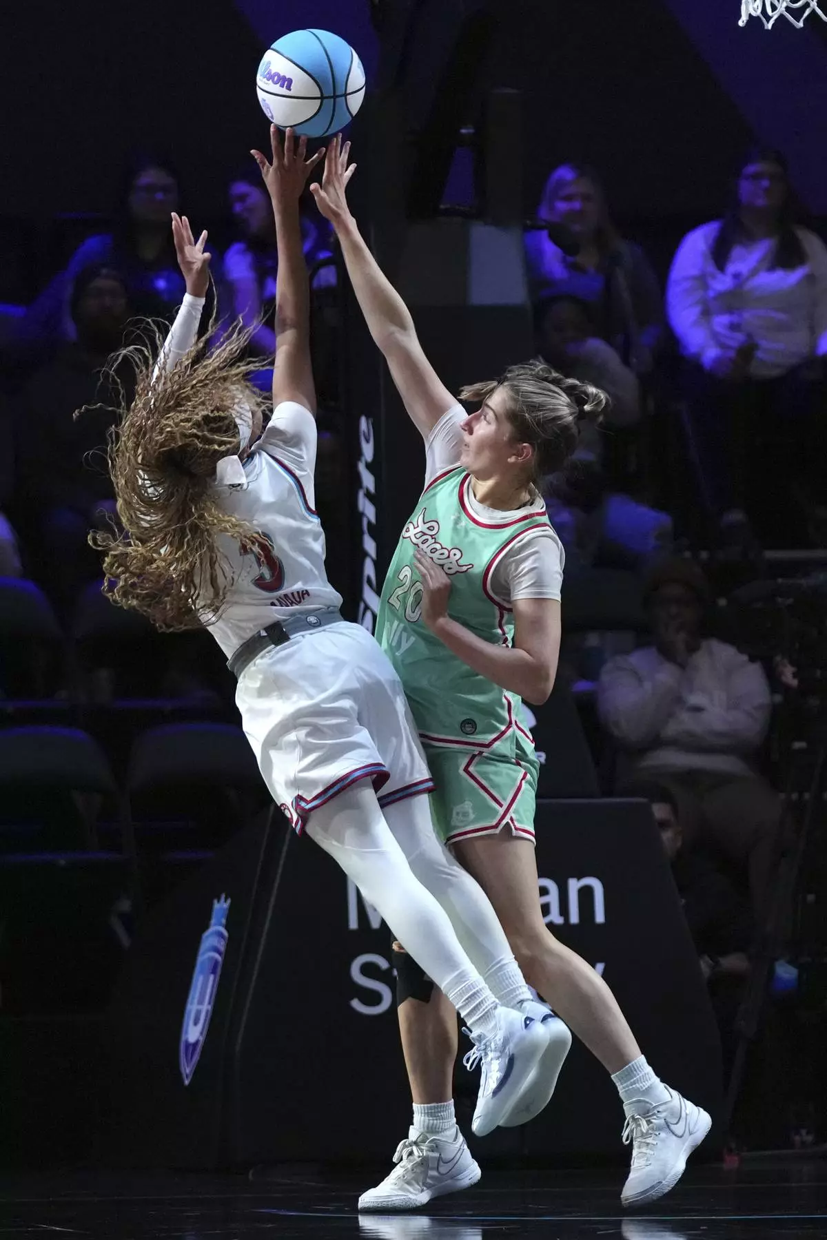 Laces guard Kate Martin (20) defends as Vinyl guard Jordin Canada (3) shoots during the first half of an Unrivaled 3-on-3 basketball game Friday, Jan. 24, 2025, in Medley, Fla. (AP Photo/Lynne Sladky)